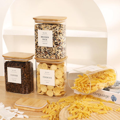 5 Pack Square Glass Pantry Storage Containers with 132 Kitchen Food Pantry Labels - Clear Glass Pantry Jars with Airtight Wood Bamboo Lids - Glass Canisters for Pasta, Cereal, Coffee, Flour, Sugar